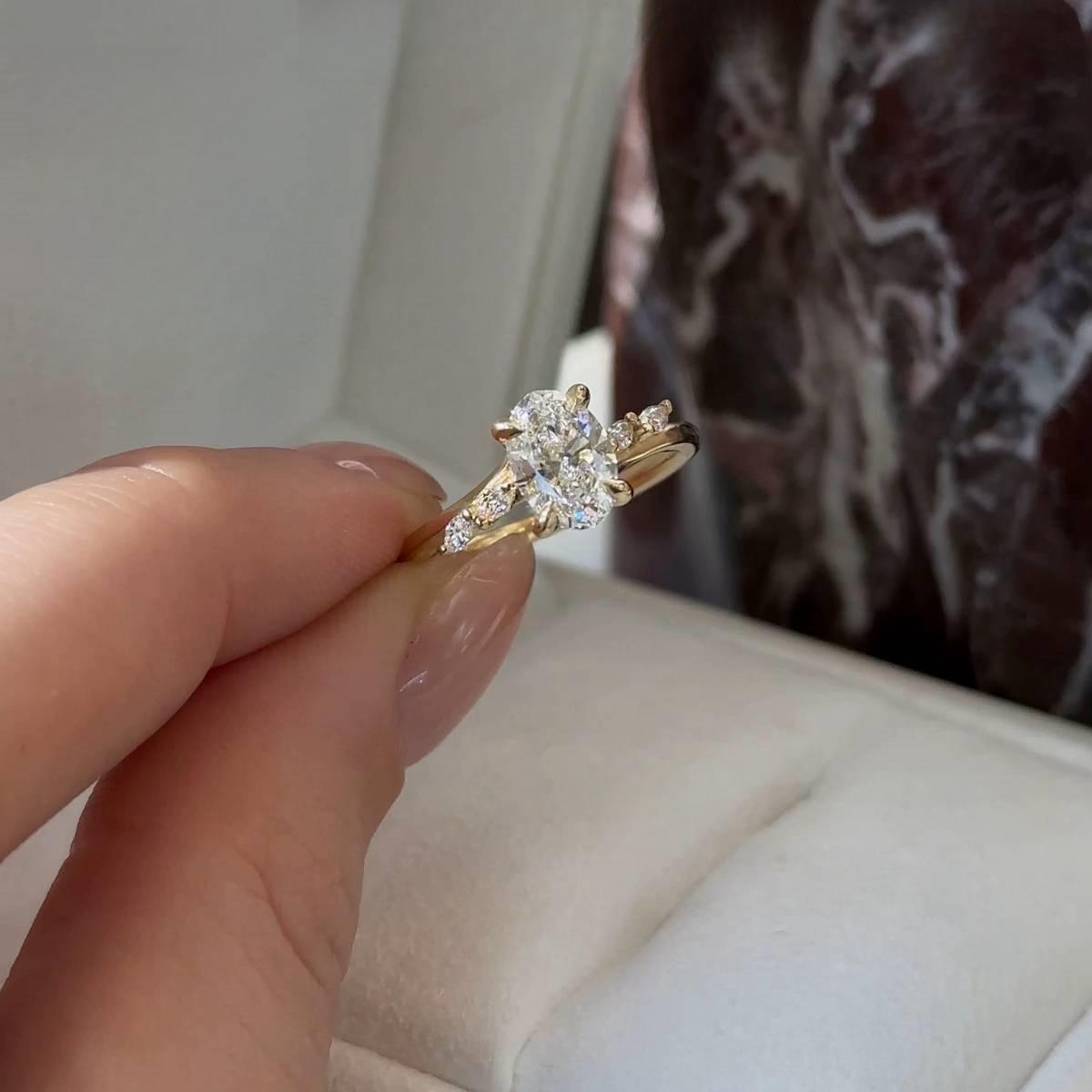 Twisted Oval with Marquise Accents Moissanite Ring